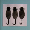 3 Black Cats on Pale Blue